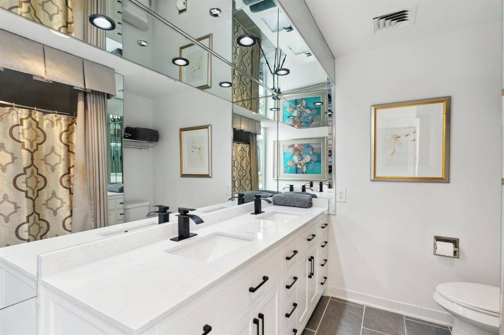 Recessed lighting and tub/shower combination.