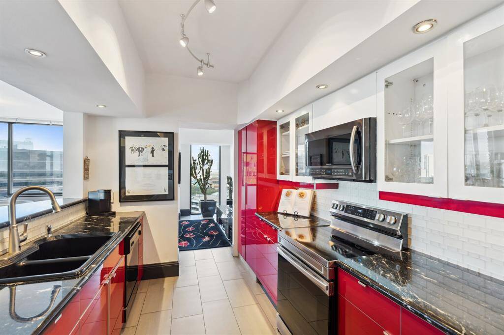 Granite counters, custom cabinetry and stainless appliances.