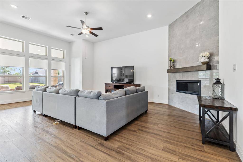 Wall of nice big double pane windows looking into your huge backyard.   LOVE this fireplace!
