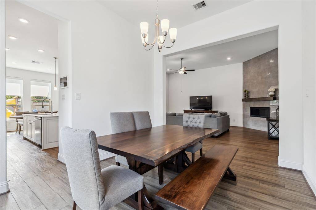 Dining area with views into the living room and kitchen.
