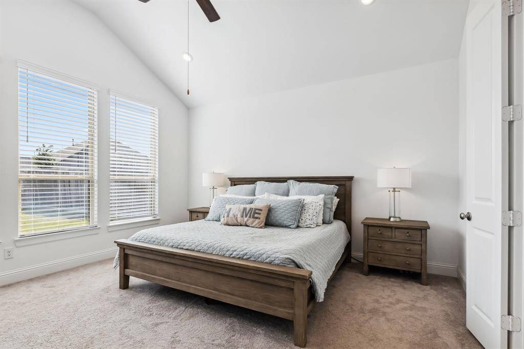 Primary Suite down stairs with views into the backyard.  This is a split plan so the primary is private in the back of the home away from the secondary bedrooms.