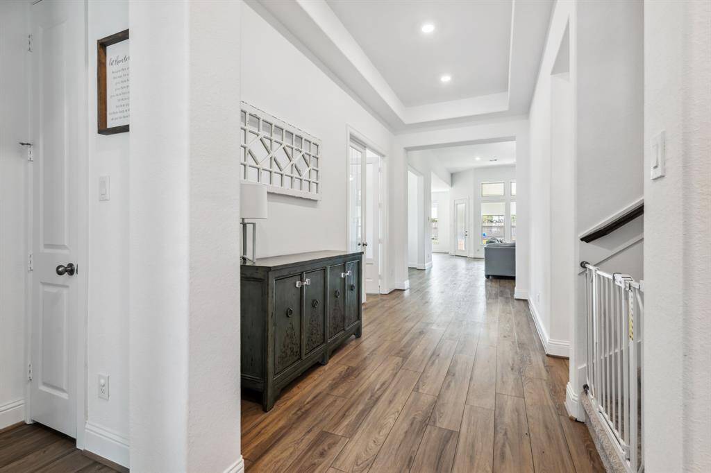 Entry to your new home with nice high vaulted ceilings and recessed lighting. Beautiful LVP flooring in all living areas.