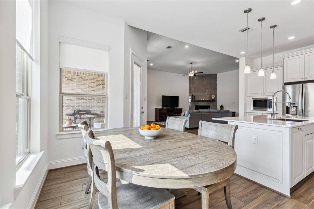 View from casual dining into living and kitchen area.