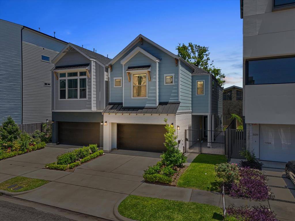 Modern two-story home featuring large windows, beautifully functional layout and lots of natural light. No HOA.