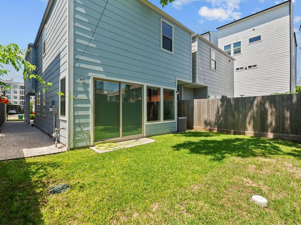 The spacious garage includes ample overhead storage, wall-mounted bike racks and a space for an extra refrigerator.