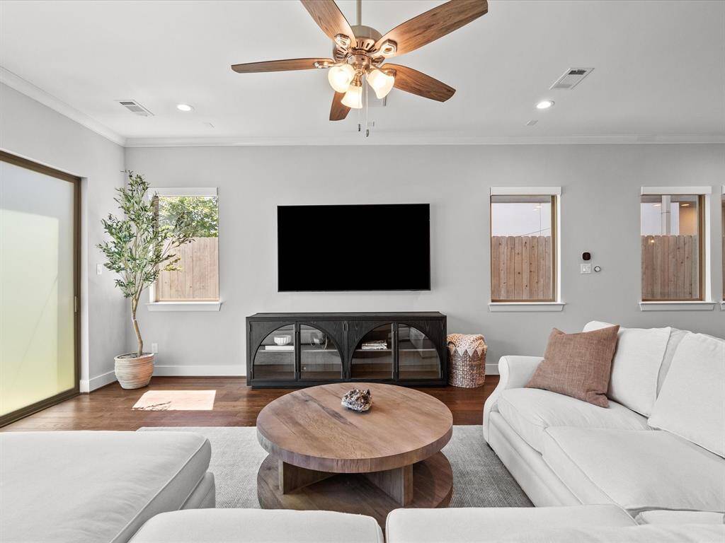 Bright and inviting living room space is complemented by a large dining area to facilitate entertaining.