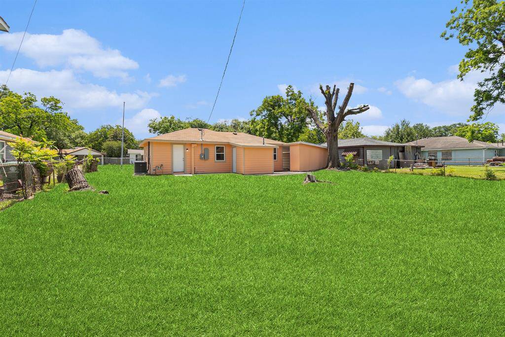 Backyard view with rear of the home.