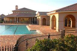 Luxurious clubhouse featuring a sparkling pool. Perfect for relaxation and social gatherings.