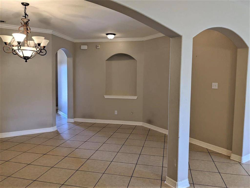 Upon entry, the dining room is on the right, seamlessly connecting to the living room.