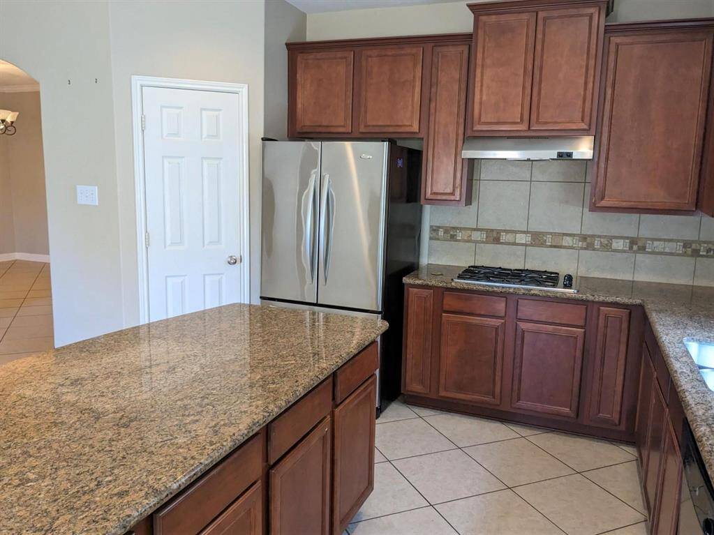 Sleek kitchen featuring stainless steel appliances and elegant cabinetry.