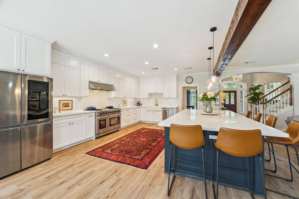 Built in refrigerator, custom cabinets.  Spacious!