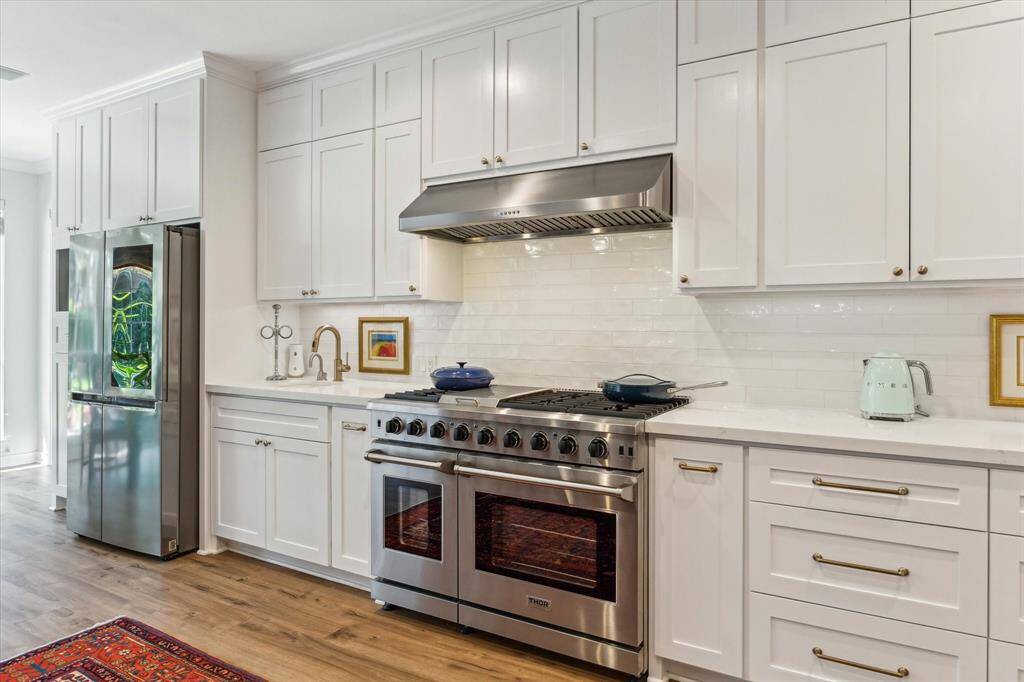 Six burner gas range with griddle.