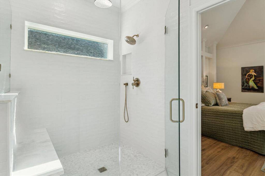 Primary shower with marble  tile.