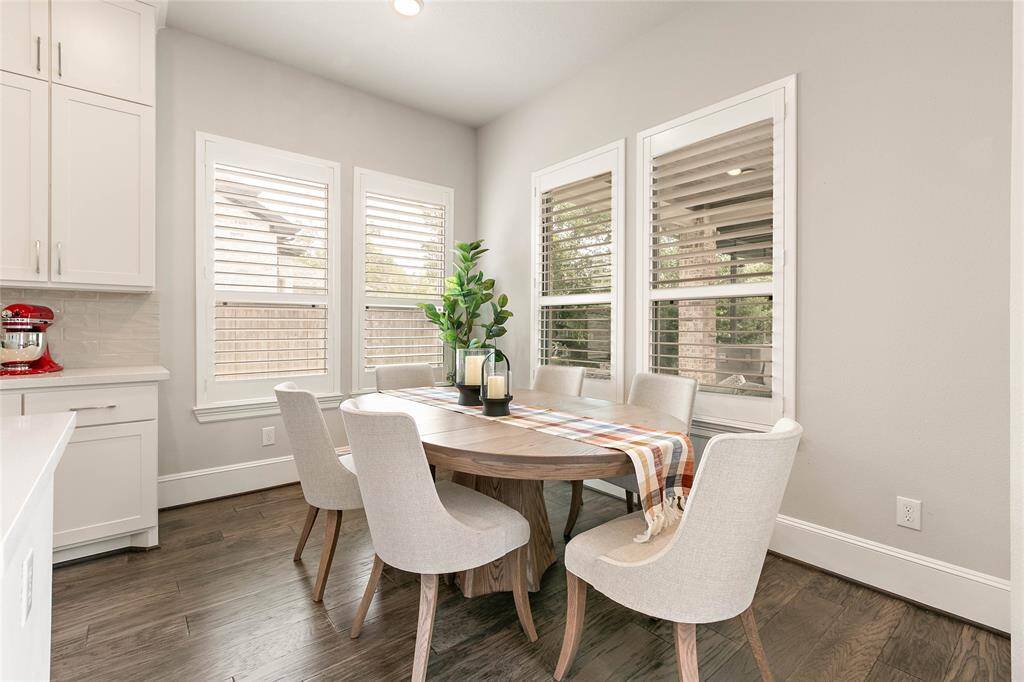 Dining area just off the kitchen with beautiful backyard views and lots of natural light.