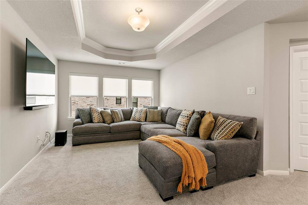 Upstairs game room with plenty of seating and a big screen tv.