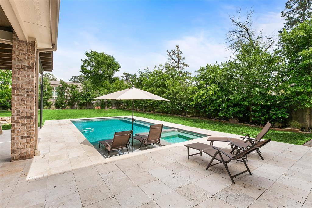 Resort-style pool with lush landscaping in your own private backyard retreat.
