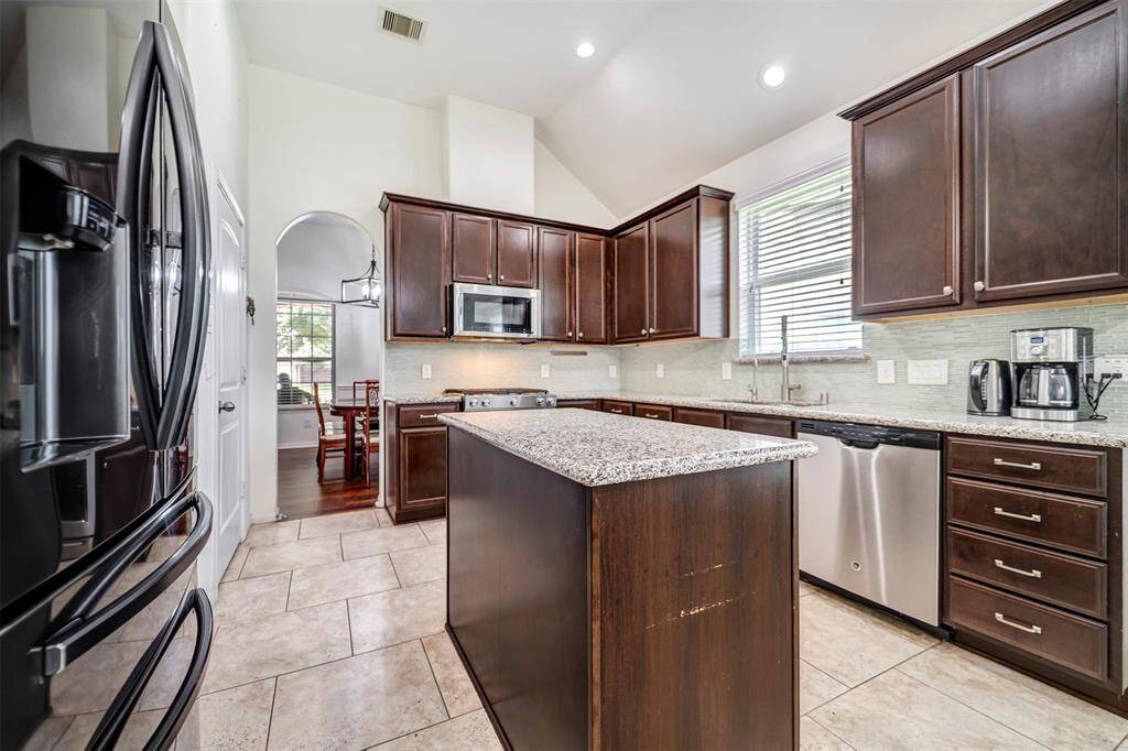 Spacious layout with abundant cabinetry and tile flooring.