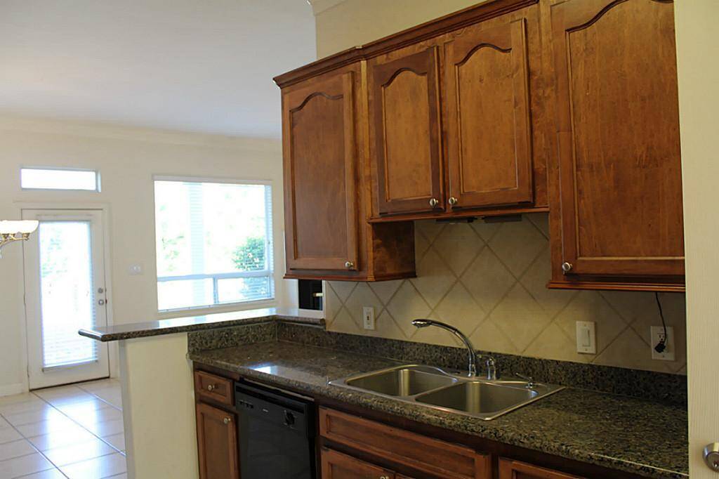 WOOD CABINETS AND GRANITE COUNTERTOPS
