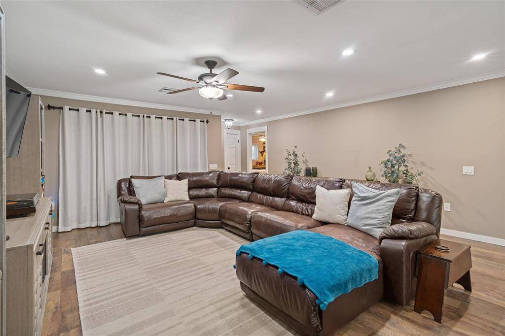 Spacious living room accented with crown molding