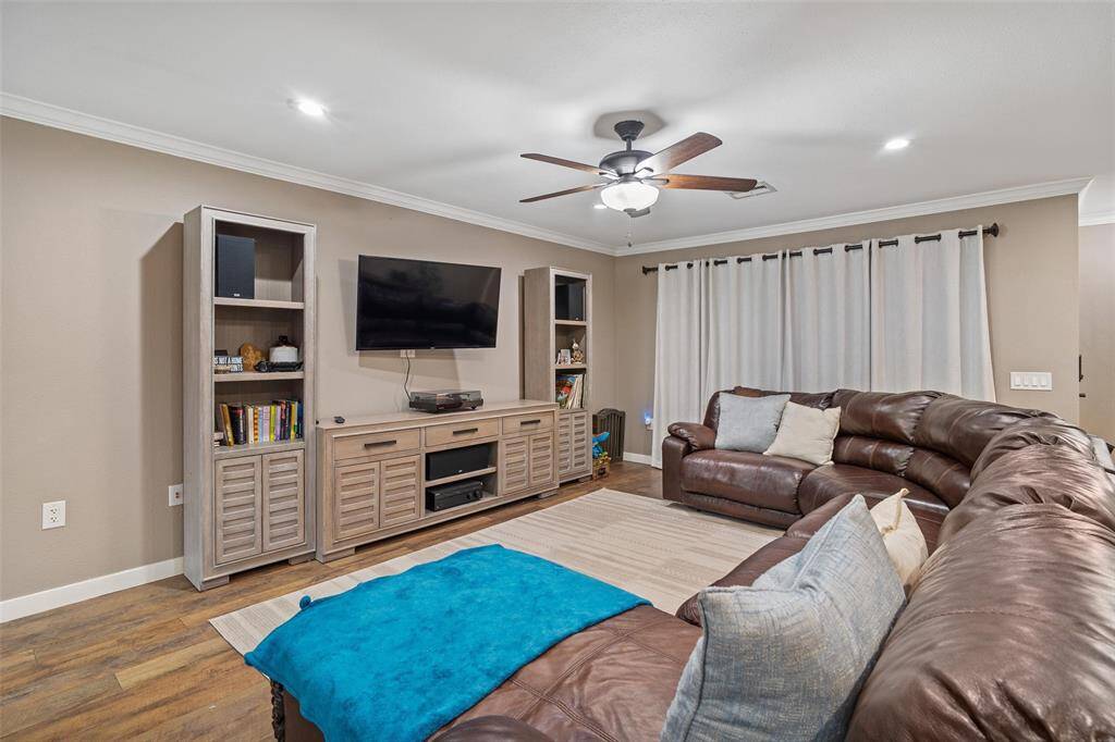 Spacious living room accented with crown molding