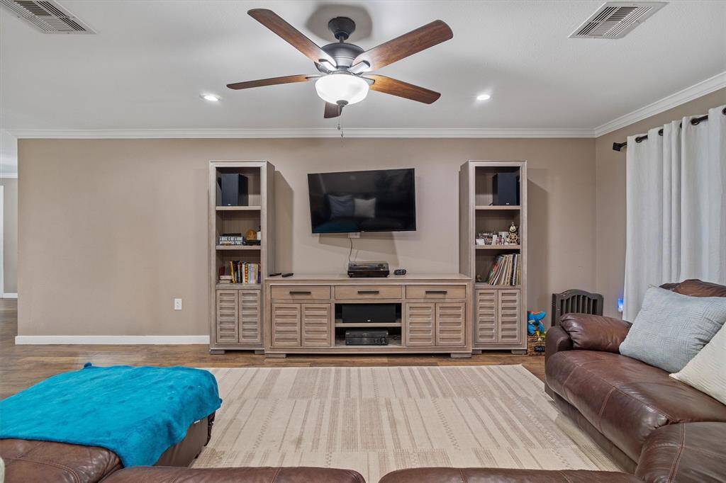Spacious living room accented with crown molding