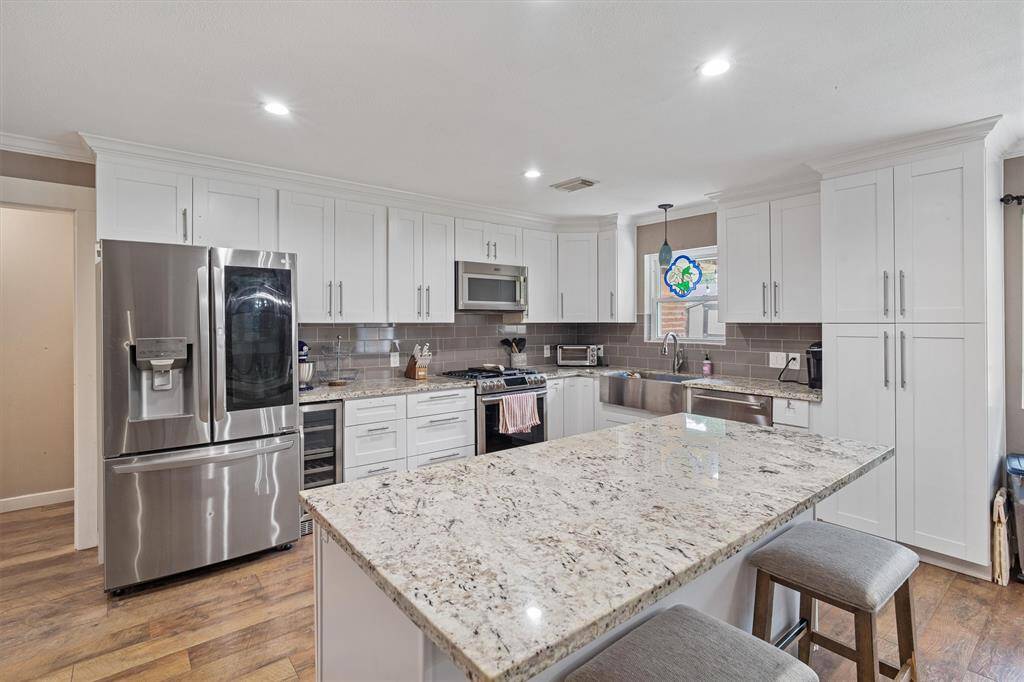 Beautiful kitchen with granite countertops and plenty of storage space