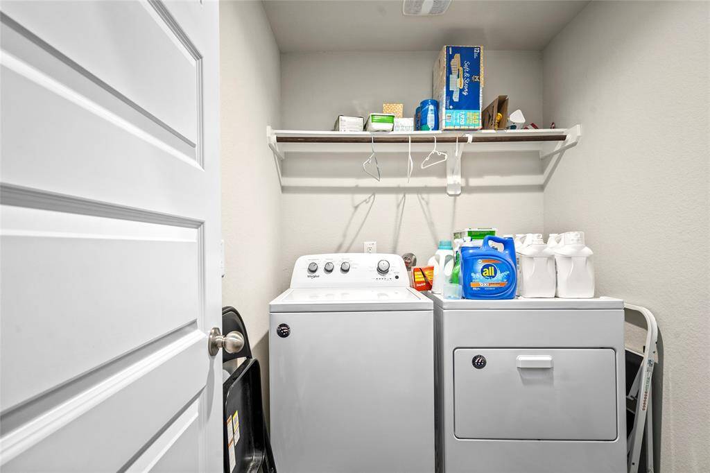 The utility room is conveniently located in a walk-in area and offers extra space for storage or organization, making laundry tasks more efficient and manageable.