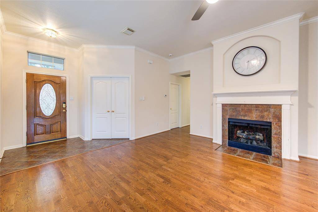 On the other side of the house, through the two double doors, is the home office. As you continue, through the archway, the hall will lead you to the two secondary bedrooms, hall bath, and laundry room.