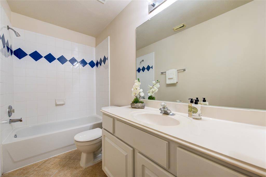 The secondary hall bathroom is right next to the two secondary bedrooms.