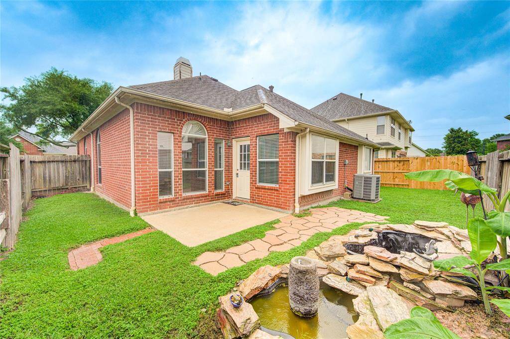 Serene backyard with a water feature that, with a little TLC, will add to the enjoyment of this house.