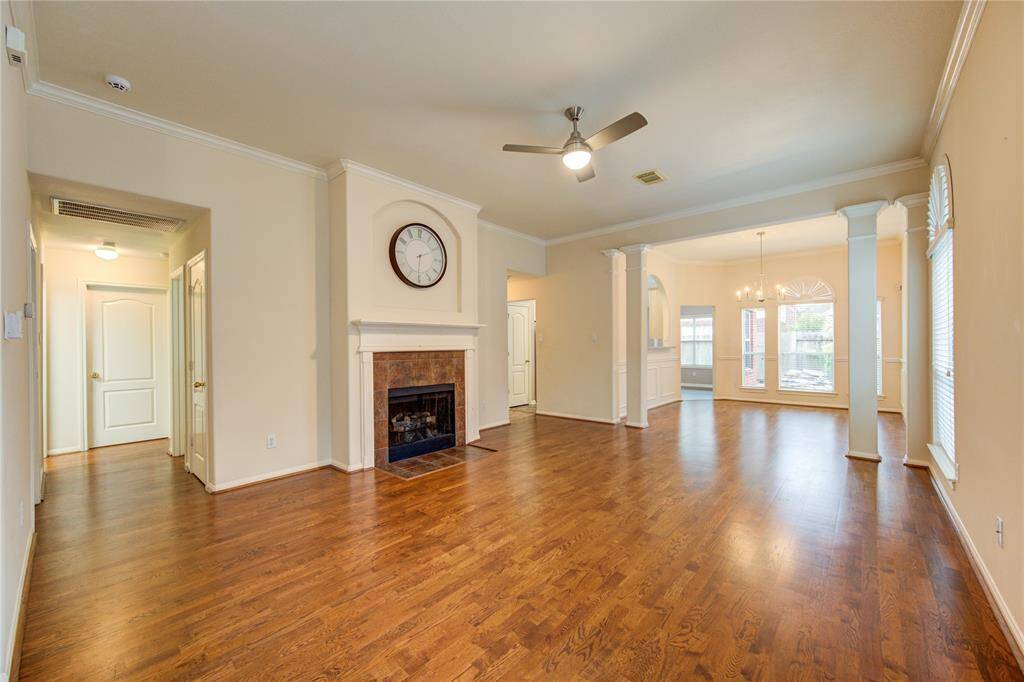 This spacious living room, which flows seamlessly into the dining room is bright and airy.
