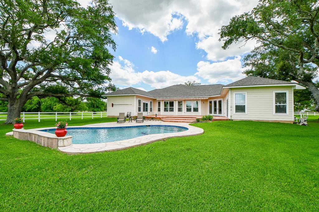 Lots of natural lighting and open views from inside the home to the backyard. Backyard looking towards the home.