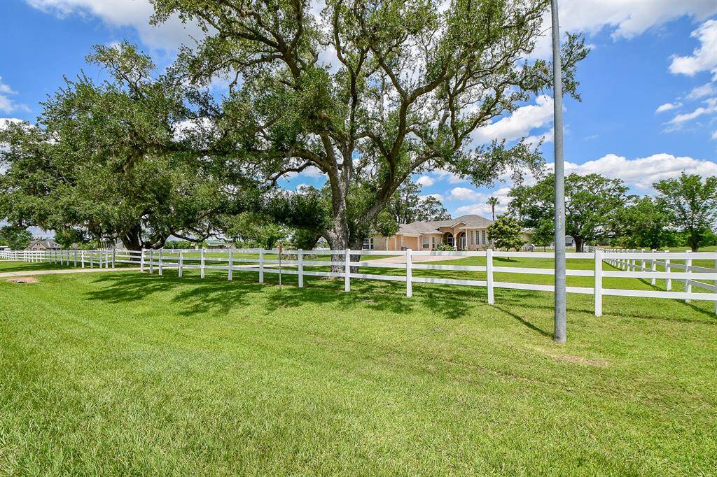 Home is fenced off to the road with an entry gate
