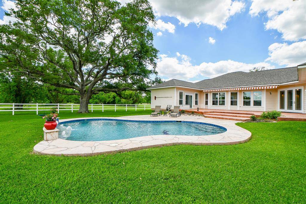 Pool has cement all around to keep out the grass and mud