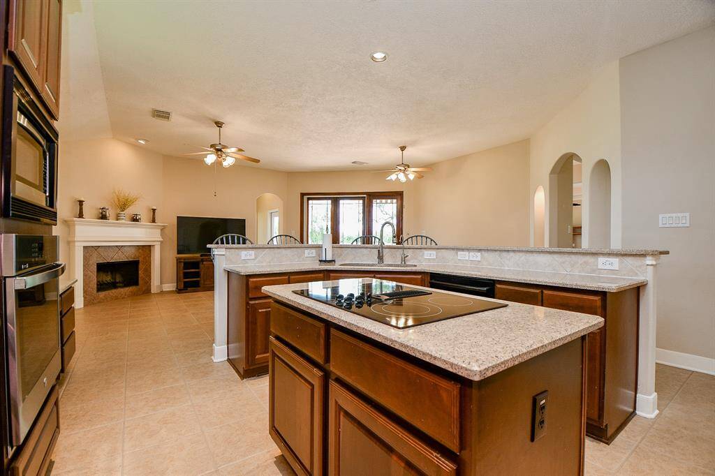 Fireplace in the family room and beautiful tile flooring throughout