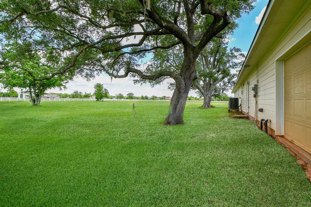 Check out that side yard. Mature trees for plenty of shade. Home is on an aerobic and well system.