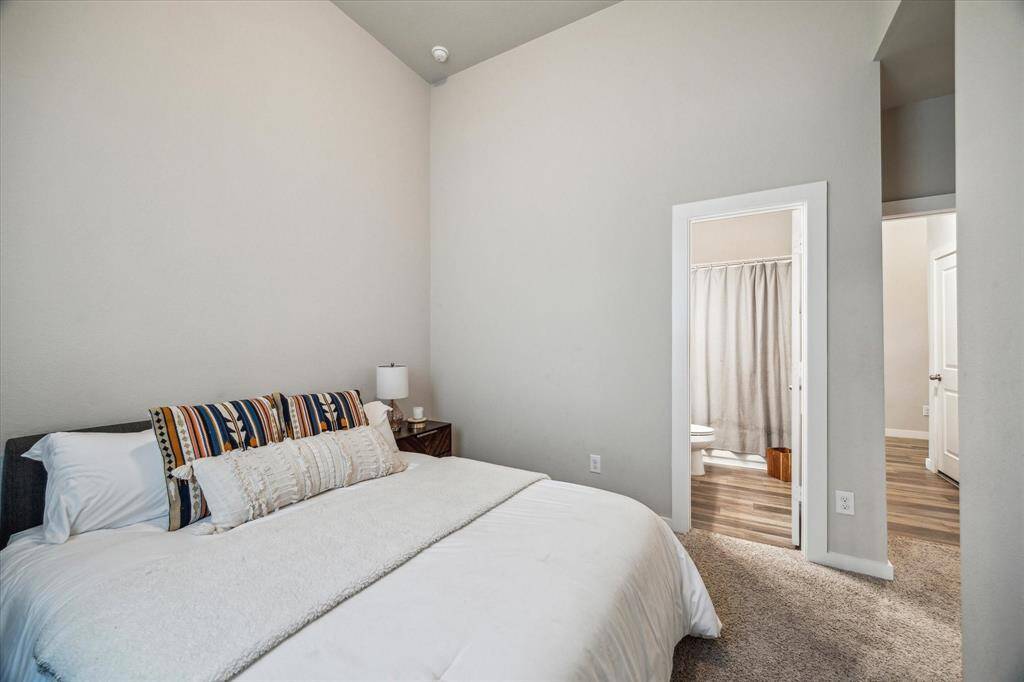Vanity area between dual sinks, and large window providing an abundance of natural light.