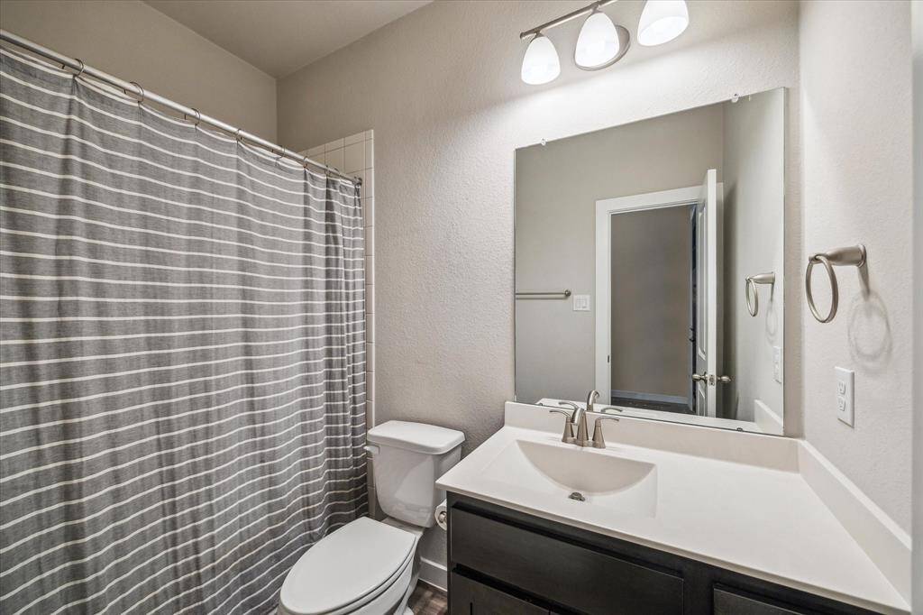 An additional bedroom on the opposite side of the entry way has a walk in closet and an unobstructed view to the back yard.