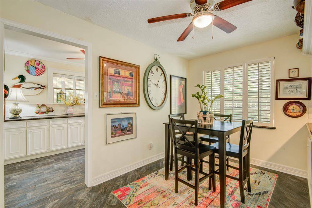 The breakfast area offers a cozy spot for casual meals and opens to a spacious laundry/mud room complete with granite countertops and plenty of cabinet storage.