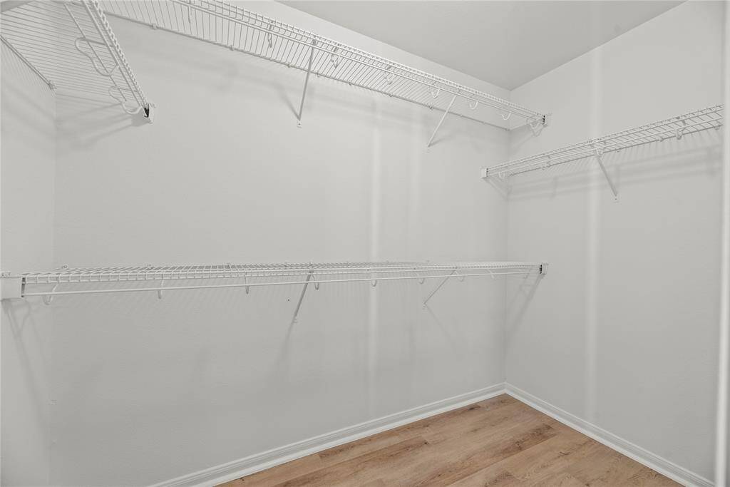 Large primary walk-in closet.