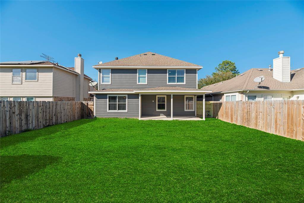 Large Backyard with covered patio.