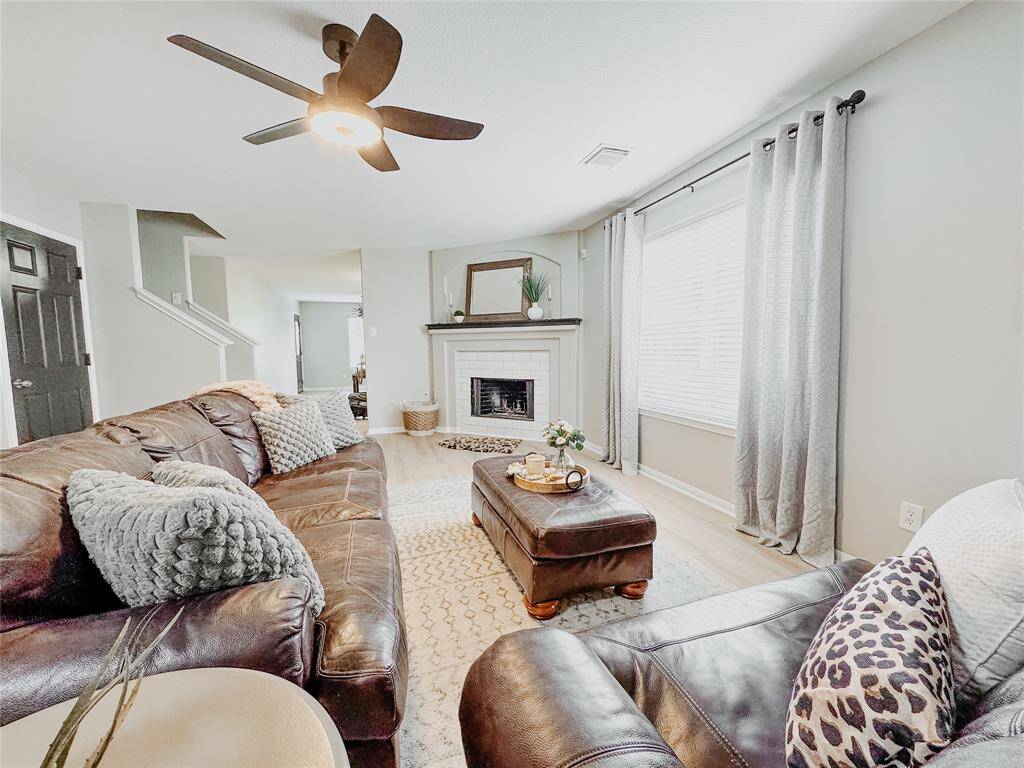 Another view of living room. Offers plenty of room for full size couch and oversized chair.