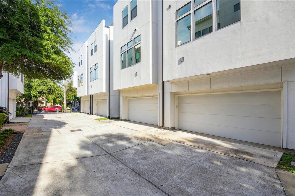 1704 A is the furthest to the right in the photo The driveway is wide and well-maintained with a gated entrance.