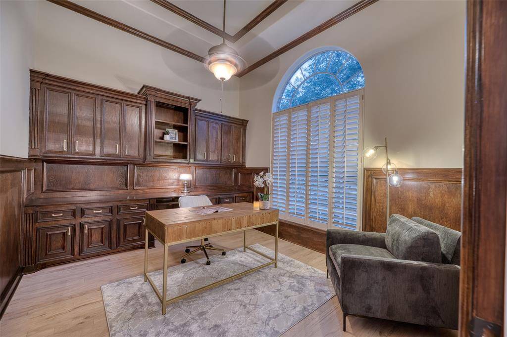 Dedicated study with large windows and French doors—ideal for remote work.