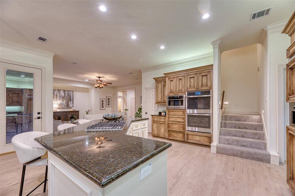 Fully updated kitchen features new appliances, granite countertops, and ample cabinetry.
