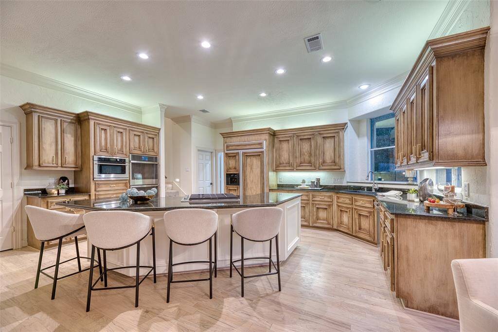 Large kitchen island offers bar seating and prep space for the home chef.