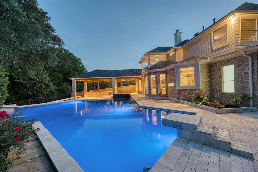 Expanded pool deck provides space for sunbathing or casual furniture arrangements.