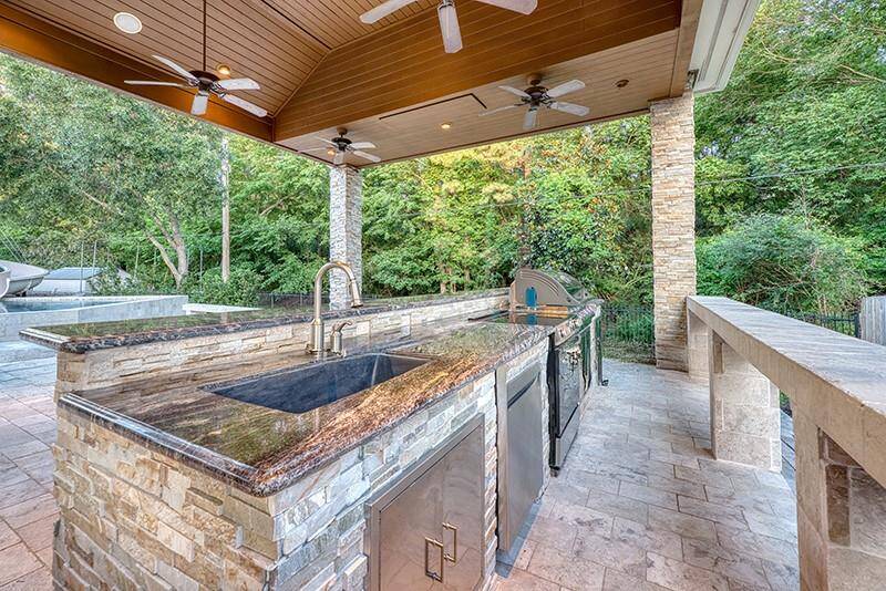 Spacious covered patio area perfect for shaded seating, outdoor dining, or grilling.