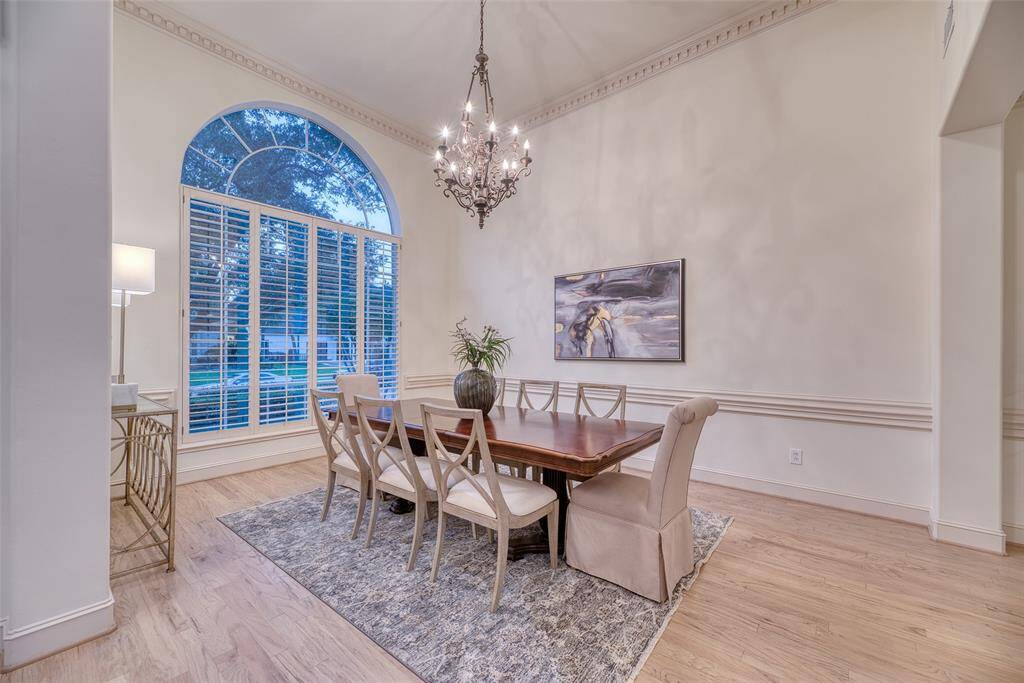 Bright and spacious formal dining area with updated lighting and trim.