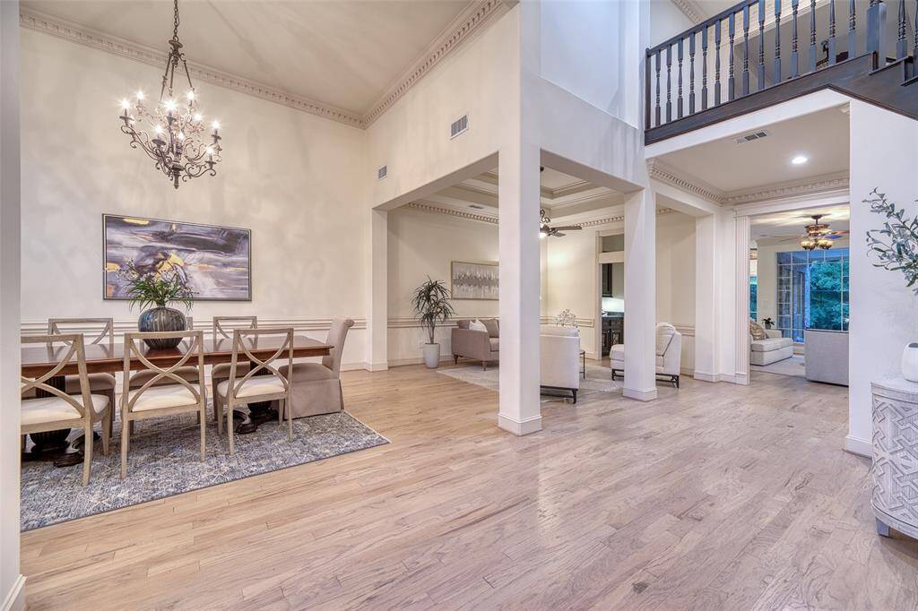 Impressive ceiling height adds grandeur to the formal sitting area and creates an airy, open feel across the main floor.